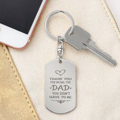 a keychain that says thank you for being the dad you didn't have to be