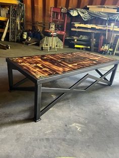 a table made out of wood and metal in a garage