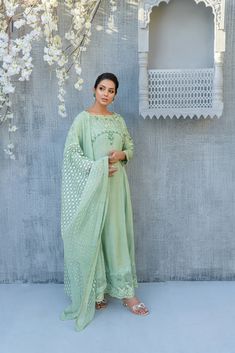 SKU: 2213 Price for Shirt, lining & Pants Ascend into the world of florals in this flowy sage green silk Kalidar ensemble glided with handwork floral details, crystal, pearls, and sequence paired with an organza dupatta with lavished laces. The border tucked with resham embroidery and florals gives this ensemble a classic look. Dupatta as is can be added. Green Silk Palazzo Set With Mirror Work, Pista Green Silk Sharara With Chikankari Embroidery, Green Silk Floor-length Palazzo Set, Floor-length Green Set With Chikankari Embroidery, Green Floor-length Set With Chikankari Embroidery, Pista Green Floor-length Sets With Chikankari Embroidery, Pista Green Silk Salwar Kameez With Chikankari Embroidery, Green Georgette Palazzo Set With Chikankari Embroidery, Pista Green Georgette Palazzo Set With Dabka