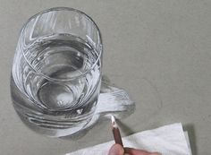 someone is drawing a glass with a pencil