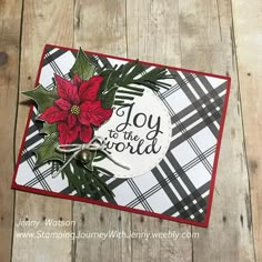 a christmas card with poinsettis and the words joy to the world