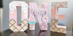 the letters are made out of wood and have ice cream on them