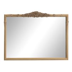 a wooden frame mirror with carvings on the top and bottom edge, against a white background