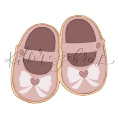 a pair of pink baby shoes with a bow on the front and side, embroidered onto it