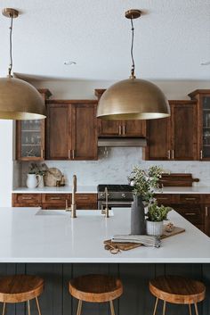 kitchen styling Amy Koehn KoehnDesign Consulting Calgary Interior Design Kitchen Backsplash Walnut Cabinets, Midcentury Transitional Kitchen, Two Tone Kitchen Island And Cabinets, Earthy Moody Kitchen, Warm Brown Cabinets Kitchen, Old Home Kitchen Remodel, Brown And Gold Kitchen, Modern Comfy Living Room Ideas, Modern Earthy Kitchen