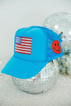 Show your patriotism with this stylish blue trucker hat featuring a fully-embellished rhinestone flag and a custom red smiley on the side. This hat is the perfect combination of fashionable and functional. All orders are currently shipping within 14 business days. To receive item quicker, expedited shipping is available at checkout. Hat Business, Blue Trucker Hat, On The Side, Trucker Hats, Smiley, Trucker Hat, Flag, Hats, Red