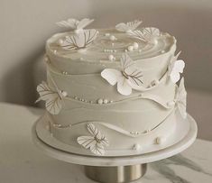 there is a white cake with flowers on it