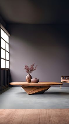 a wooden table with two vases sitting on top of it next to a chair