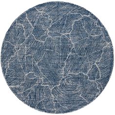 a round rug with blue and white designs on it