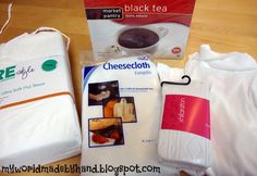 the contents of a diaper laid out on top of a wooden floor next to a package of black tea