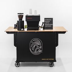 a coffee bar with various items on the top and below it, including an espresso machine