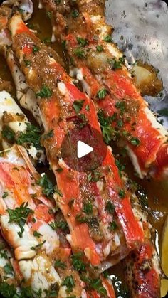 the fish is covered in sauce and garnished with parsley