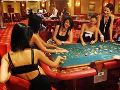 people playing roulejack in a casino room