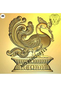 a golden bird is sitting on top of a vase with an ornate design in the center