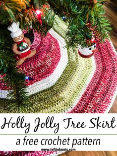 a crocheted christmas tree skirt with ornaments on it