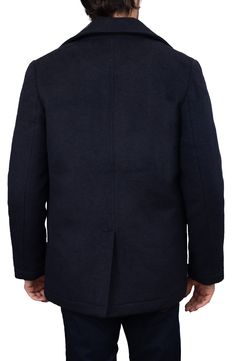 A wool-enhanced blend supports the soft structure of this timeless peacoat cut in a slightly boxy silhouette, allowing for easy layering as the temperatures change. Double-breasted button closure Notched lapels Back vent 70% polyester, 30% wool Dry clean Imported Navy Wool Outerwear With Concealed Placket, Navy Wool Coat For Business, Navy Wool Long Pea Coat, Tailored Navy Wool Peacoat, Navy Tailored Wool Peacoat, Navy Wool Coat With Buttons, Navy Winter Outerwear With Concealed Placket, Navy Outerwear With Notch Lapel And Button Closure, Navy Wool Pea Coat For Business