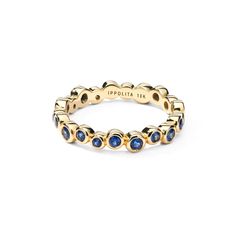 a gold ring with blue sapphire stones