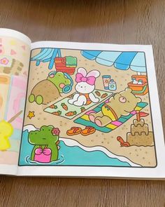 an open children's coloring book on a table