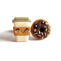 two miniature donuts and a cup of coffee