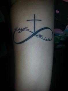 a tattoo with the word hope and an infinite cross on it's left arm