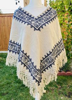 These authentic "Quexquemetl" are handwoven by indigenous artisans in Hueyapan Puebla. Every design is unique, embroidered with creativity, love and incredible skill. Simply beautiful! Measuring approximately 34" wide by 26'' long, one size should fit all adults. Traditional Fringe Poncho One Size, Winter Festival Embroidered Poncho, Folk Style Festival Poncho One Size, Traditional Festival Poncho With Woven Motifs, Traditional Embroidered Poncho For Winter, Traditional Embroidered Winter Poncho, Folk Style Handwoven Shawl, Handwoven Folk Shawl One Size, Traditional Winter Poncho