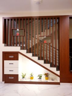 the stairs are made of wood and have planters on each side in front of them