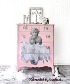 a pink dresser with an image of a baby on it