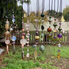 Give your car some jewelry and add a little magic to your drive! Handcrafted rear view mirror charms made with love from my heart to yours <3  Approx. 8 inches long, with about 4.5 inch elastic section and between 3-4 inch beaded section. Genuine stone, shell, and crystal beads used-- A: rose quartz, rhodonite B: amethyst, pink coral, rose quartz, rhodonite, ballet slipper charm C: clear quartz, tourmaline, sugilite, rose quartz D: amethyst, opalite (glass), and mystery green stone (guessing agate or jasper) E: amethyst, calcite, abalone shell, reversible sun moon beads F: labradorite, amethyst, opalite (glass) G: carnelian, amethyst, chrysocolla, flying bird bead H: clear quartz, wooden seed, green agate, moss agate I: green jasper, clear quartz, aventurine, moss opal, pyrite, tree agate Hippie Crafts Diy, Beaded Car Charms, Copper Wire Crafts, Crystal Car Charms, Hippie Crafts, Mirror Charms, Car Rearview Mirror Accessories, Magic Crafts, Car Hangers