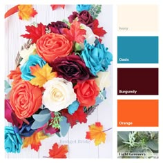 an arrangement of flowers and leaves in shades of red, orange, blue, yellow