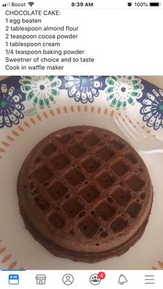 a plate with a waffle on it and a fork next to it that says chocolate cake