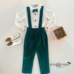 Need a beautiful suspenders set for your little Prince? This is it! The Connor Suspenders Set in Green comes with everything you'll need. It includes perfectly pleated velvet slacks with suspenders, a high-quality, silky cotton shirt, and an adorable bow tie. Your little man will be the best dressed in town in one of our suits! Our Couture pieces are made with as much attention to detail and luxurious fabrics as gentlemen's suits. Silky White Cotton Dress Shirt, Rich Cotton/Poly Blend Fabric 6-1 Ring Bearer Outfit Emerald Green, Tiana Wedding, Pleated Slacks, Happy Gilmore, Shirt With Lace, Suspenders Set, White Cotton Dress, Lace Ruffle, Ring Bearer