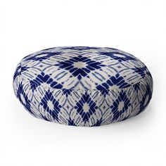 a blue and white round poufce on a white background