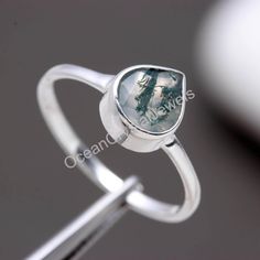 "Natural Moss Agate Engagement Ring, Green Mossy Silver Ring, 925 Sterling Silver Rings, Unique Birthday Gift, Gift For Lovers, Wedding Ring, Material          -   925 Sterling Silver Stone Name    -   Moss Agate  Stone Size      -    7X7 mm  Weight          -     1.80 Gm. Stamp -               925 \"Payment\" We Accept Payment Only Through PayPal  \"Shipping Handling Time: We Take no handling time, We ship to Worldwide, Please make sure your shipping address is correct. Shipping Services: The s Packing Business, Moss Agate Stone, Moss Agate Engagement Ring, Agate Engagement Ring, Rings Unique, Unique Birthday, Heart Shaped Rings, 13 Days, Shipping Services