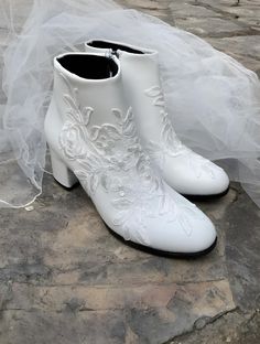 Wedding Lace Long Boots Add a touch of elegance to your wedding with these beautiful handmade shoes. The shoes design features, lace and pearls, making it perfect for the bride or bridesmaids. The lace are delicately strung together, creating a charming and romantic look. These shoes are personalized with your choice of size and are suitable for your parties.  You can take a look at my other products. If you have any questions about custom design or any other questions, please send me a message. Lace Boots Wedding, Winter Wedding Boots, Boots Bride, Lace Wedding Boots, Bride Boots, Bridal Shoes Vintage, Boots Wedding, Reception Shoes, Bridal Sneakers