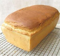 a loaf of bread sitting on top of a cooling rack