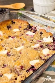 a blueberry cobbler in a glass baking dish