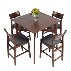 a wooden table with four chairs and a flower vase on top of it, against a white background