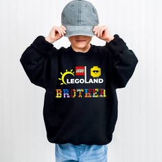 Personalized Legoland Birthday Toddler Sweatshirt: Redefining Elegance in Accessories Introduction: Welcome to a New Realm of Sophistication Prepare to be captivated by our latest masterpiece in the world of luxury accessories, the Personalized Legoland Birthday Toddler Sweatshirt. This isn't just a product; it's a work of art that embodies the pinnacle of style and craftsmanship. Designed for those who seek the extraordinary in every aspect of their lives, our Personalized Legoland Birthday Tod Black Long Sleeve Sweatshirt For Birthday, Black Crew Neck Sweatshirt For Birthday, Black Graphic Print Sweatshirt For Birthday, Legoland Birthday, Luxury Accessories, High End Fashion, Kids Sweatshirt, Individual Style, Travel Style