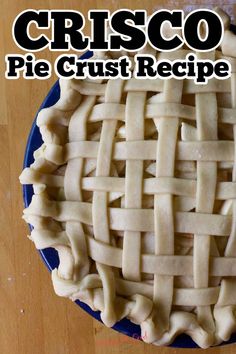 a pie crust on a blue plate with the words crisco pie crust recipe