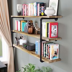 two wooden shelves with books and other items on them