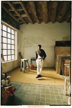 a man is standing in an empty room