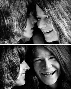 two women with long hair are smiling and touching each other's foreheads together