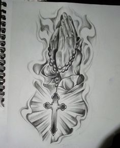 a drawing of a rosary with a cross on it and flames coming out of it