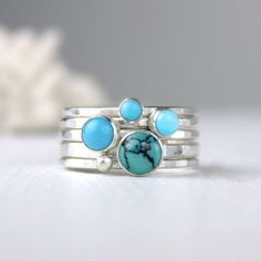 Turquoise and silver stacking rings created from recycled silver and four different turquoise gemstones. For the largest stone you can choose to either have one with lovely matrix (first picture) or solid color (fifth picture). The others are different complimentary shades of solid blue. The rings coordinate beautifully giving you many options. Artfully simple if worn alone, they can be worn with other stacking rings for a pop of color. Also, available with oxidized finish (last picture). If you Unique Stackable Turquoise Jewelry, Unique Turquoise Stackable Jewelry, Handmade Turquoise Stackable Rings In Sterling Silver, Unique Turquoise Sterling Silver Stackable Rings, Minimalist Stackable Turquoise Ring, Unique Blue Stackable Jewelry, Minimalist Turquoise Gemstone Stackable Rings, Unique Stackable Turquoise Ring, Stackable Blue Turquoise Ring In Sterling Silver