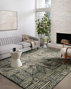 a living room filled with furniture and a fire place