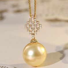 * Condition: Brand new * Center Stone: Natural Golden South Sea Pearl 13-14mm * Side Stone: Natural White Diamond, Round Cut, approx 0.15ct (VVS clarity with F color)  * Pearl Shape Grade: Perfectly Round * Metal Purity: 18K Solid Yellow Gold * Necklace Chain Length: 40-45cm (adjustable) * Superior pearls standard - 99% of the pearl surface is clean. An extremely detailed and up-close study of the pearl is needed to find imperfections. * The item will be gift wrapped and shipped. --------------- Luxury Yellow Gold Refined Pearl Necklace, Luxury Yellow Gold Diamond Necklace, Exquisite Yellow Gold Pearl Necklace, Luxury High Luster Necklaces For Formal Occasions, Luxury Pearl Necklace With Brilliant Cut For Formal Occasions, Elegant Yellow Gold Pearl Necklace For Formal Occasions, Luxury Yellow Gold Necklace With High Luster, Exquisite Yellow Gold Pendant Pearl Necklace, Luxury Akoya Pearl Diamond Necklace For Wedding