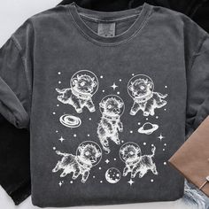 a t - shirt with cats and planets on it