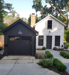 two garages in front of a white house