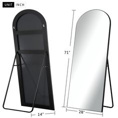 a large mirror next to a stand with a coat hanging on it's side