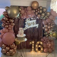 a birthday party with balloons, cake and decorations